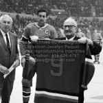 Le 21 septembre 1969, Jack Latter remet à Jean Béliveau le chandail numéro 9 des As de Québec que celui-ci portait à l'époque où il était membre de l'équipe